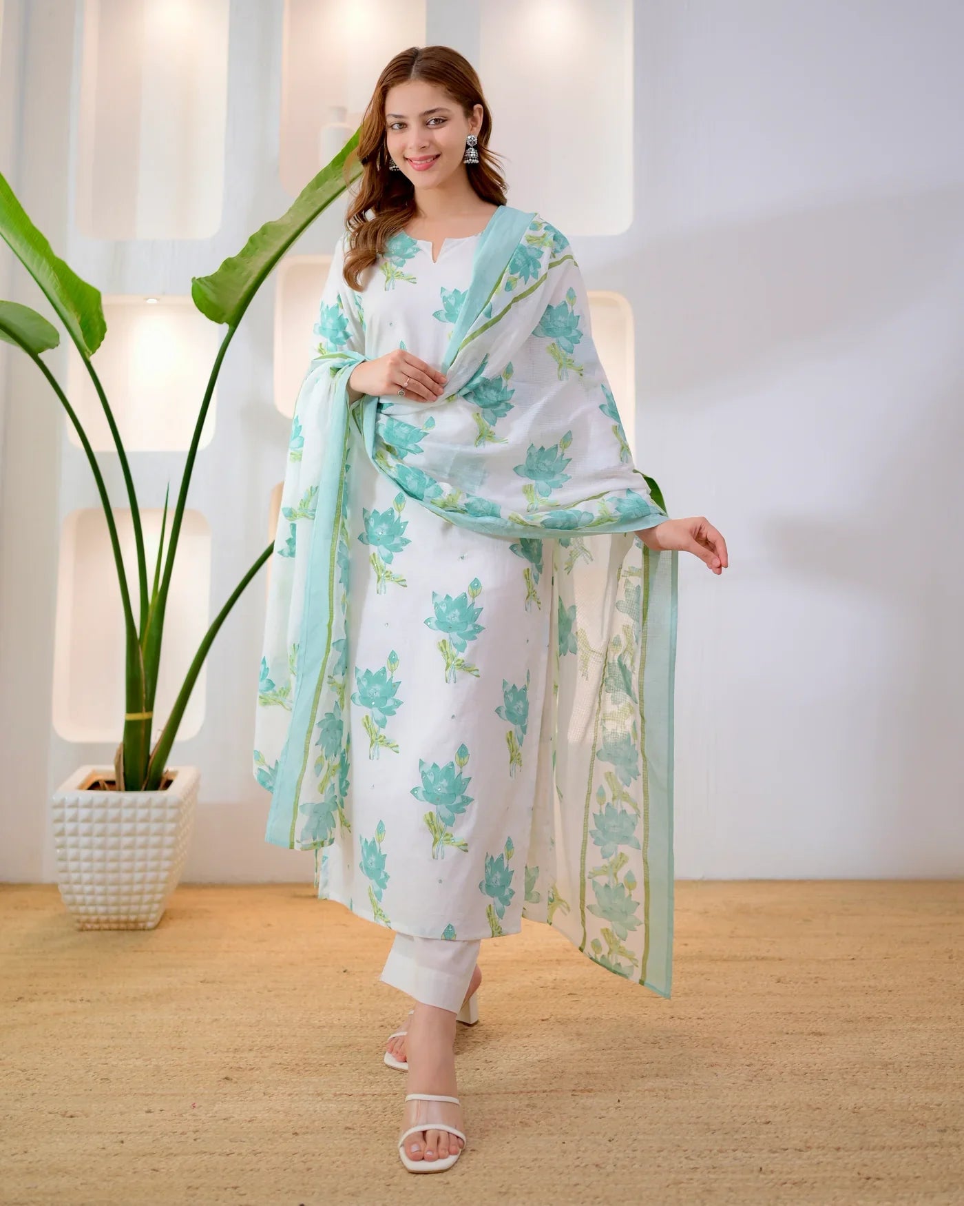 Close-up of turquoise floral print on premium cotton suit